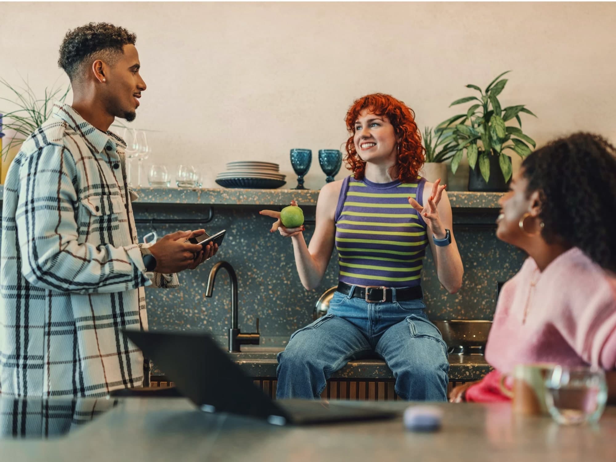 A team talking through ideas in a kitchen